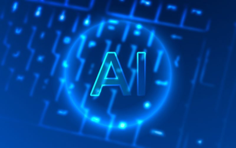 AI symbol illuminated on a keyboard, representing digital marketing and AI-driven content optimization strategies.